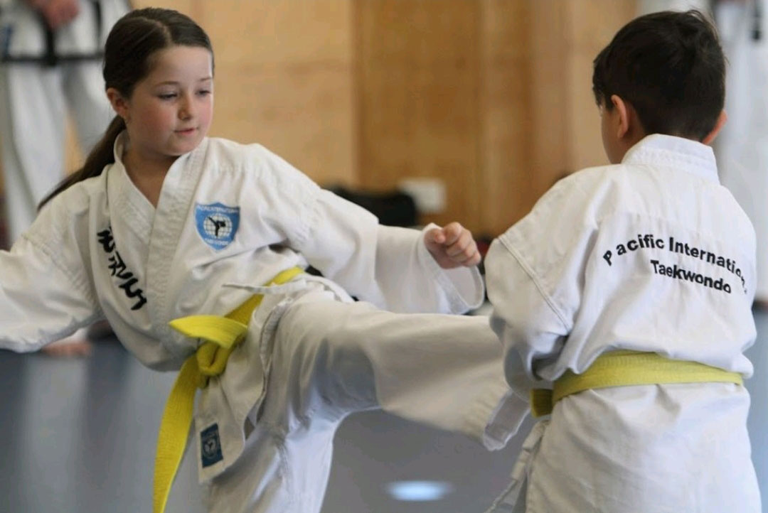 girl-kicking-boy-taekwondo