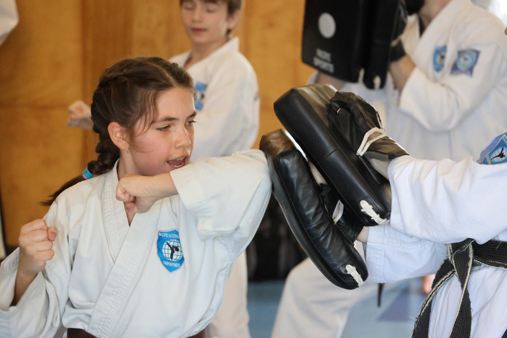 girl using her elbow to defend herself