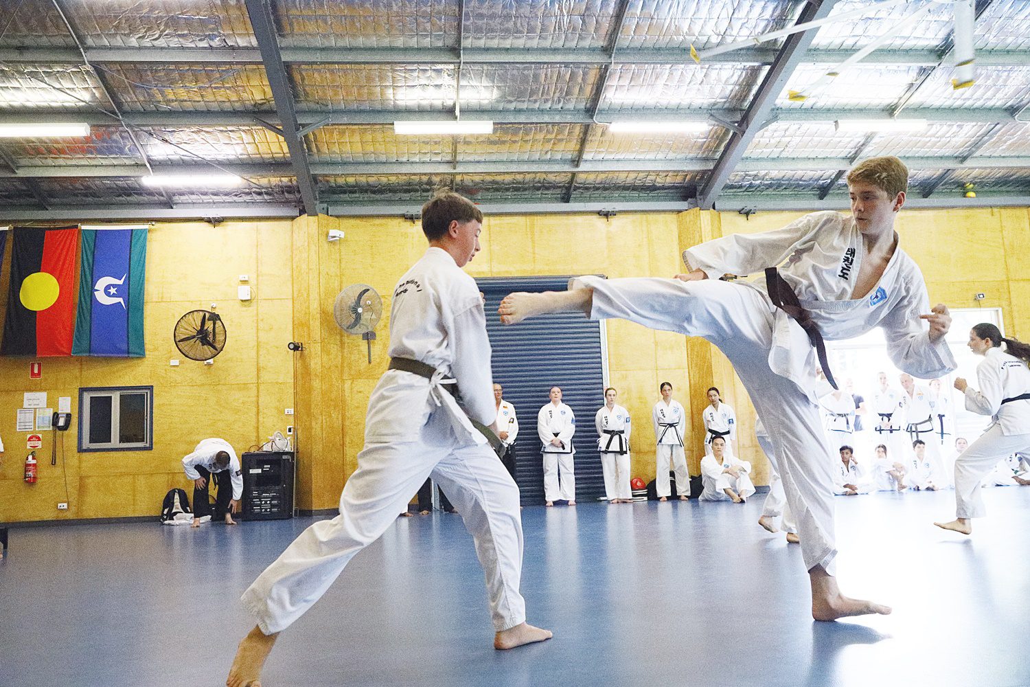 teen males taekwondo sparring