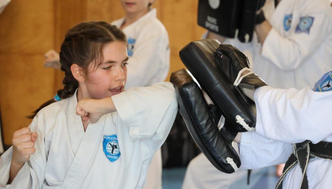 girl using her elbow to defend herself