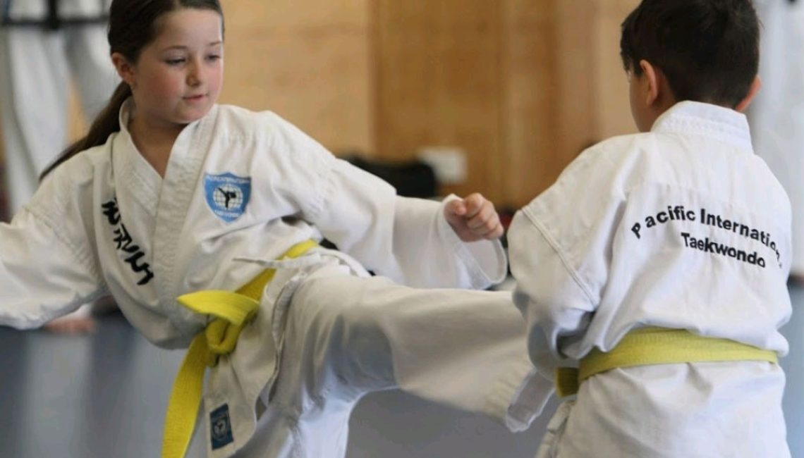 girl-kicking-boy-taekwondo